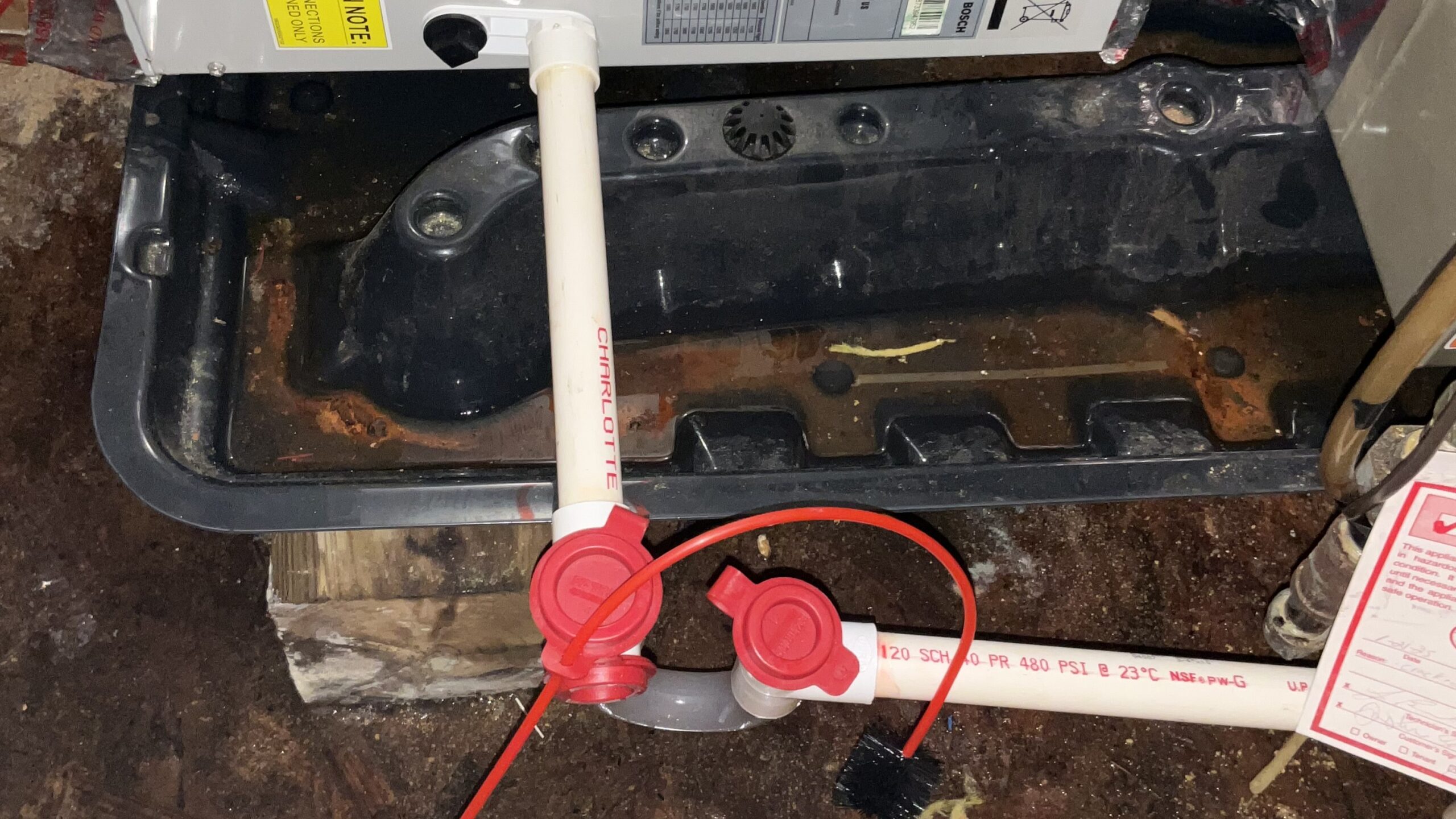 An example of drain line clogs in Long Island air conditioners serviced by Universe is shown