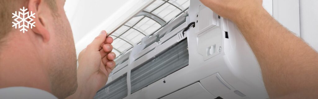 Man fixing air conditioner