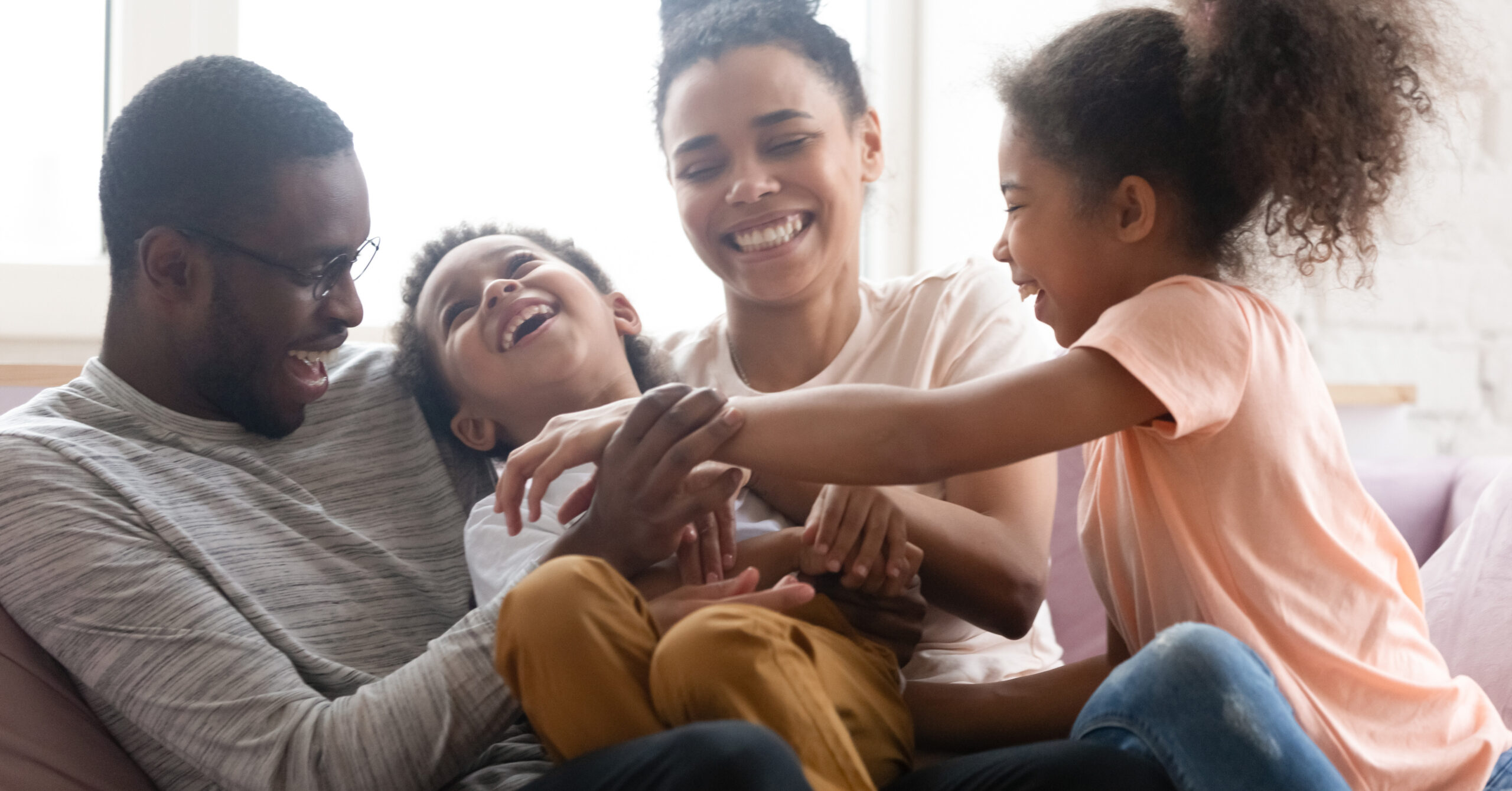 Family sitting together smiling