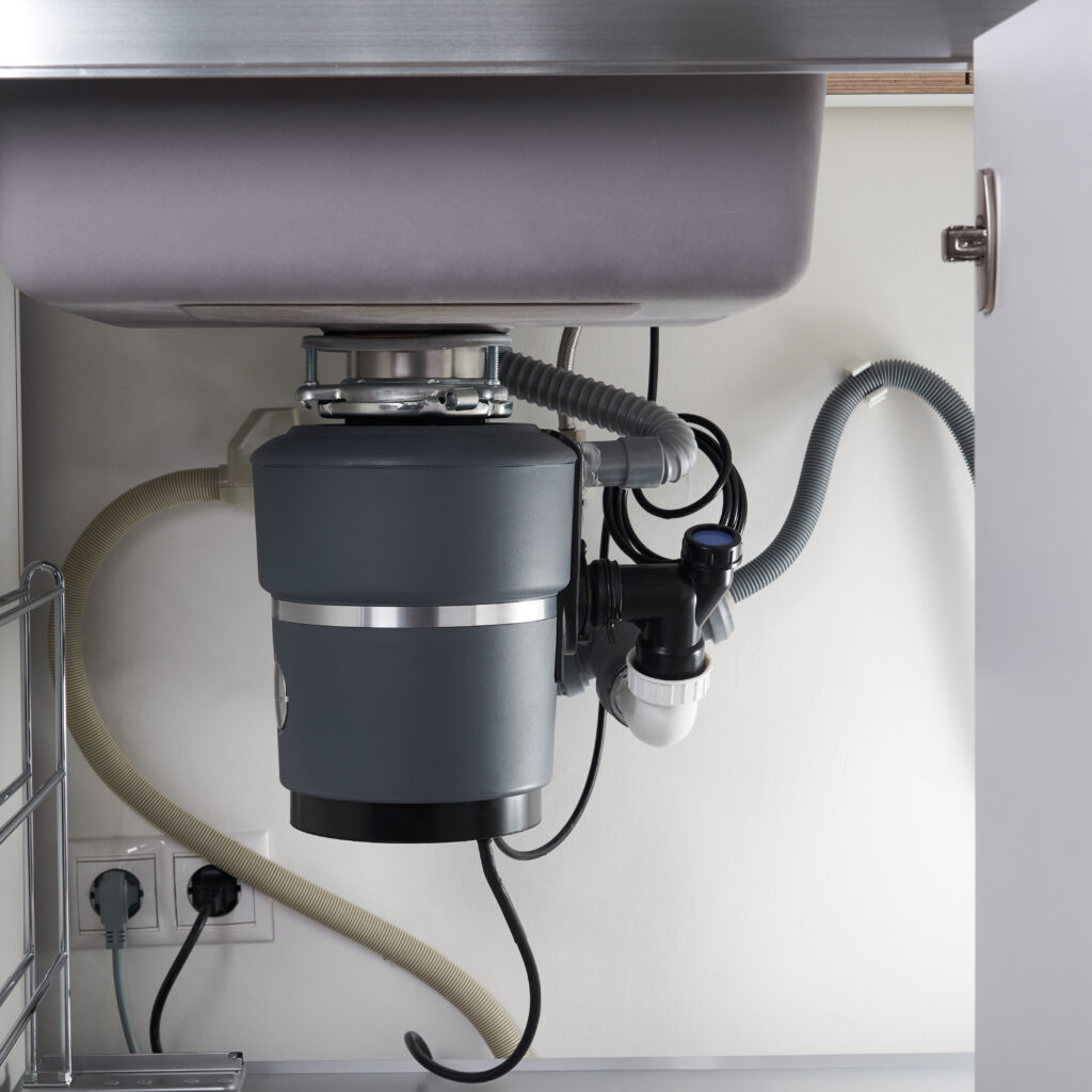 Kitchen garbage disposal installed under sink