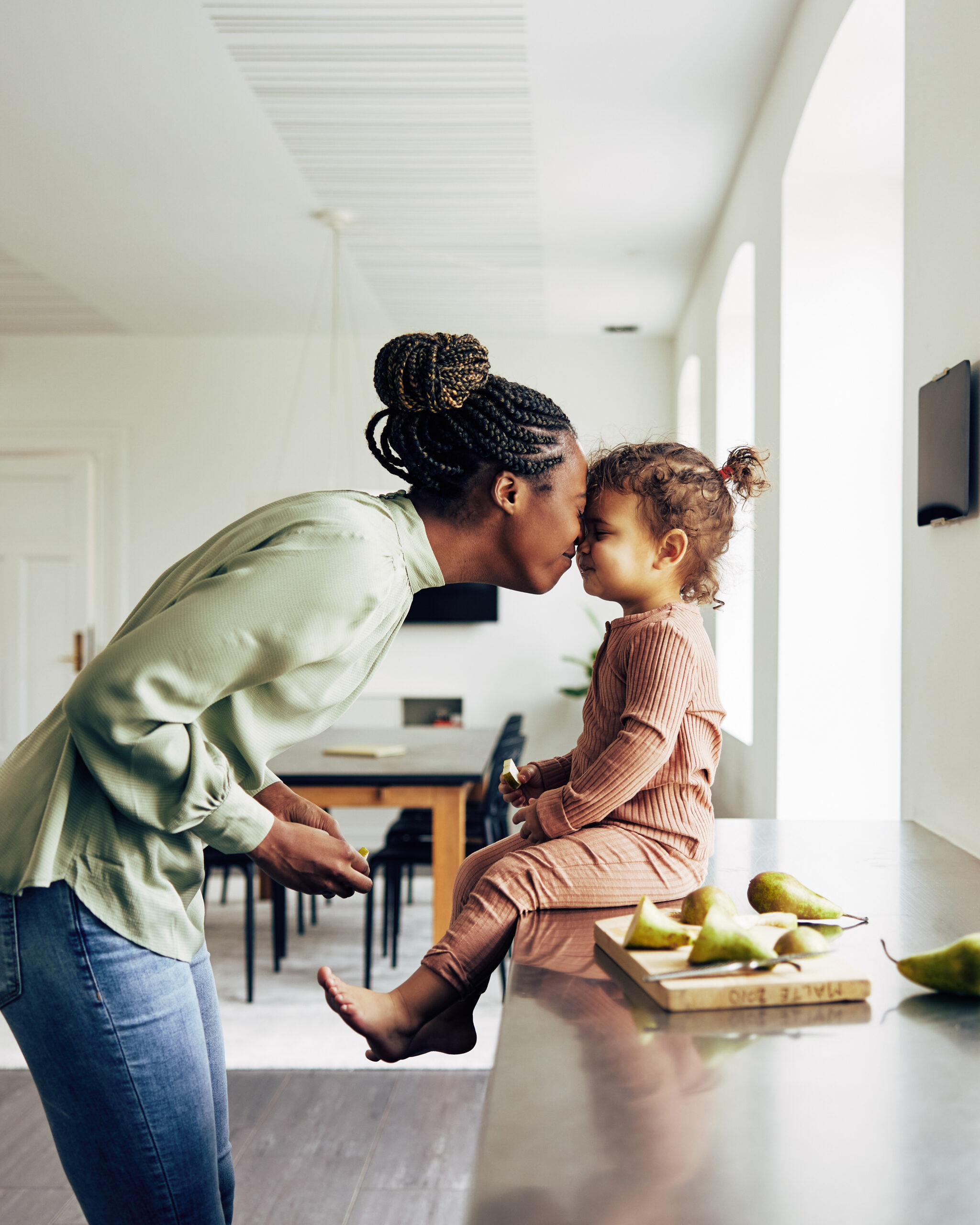 Parent cooking with child in kitchen