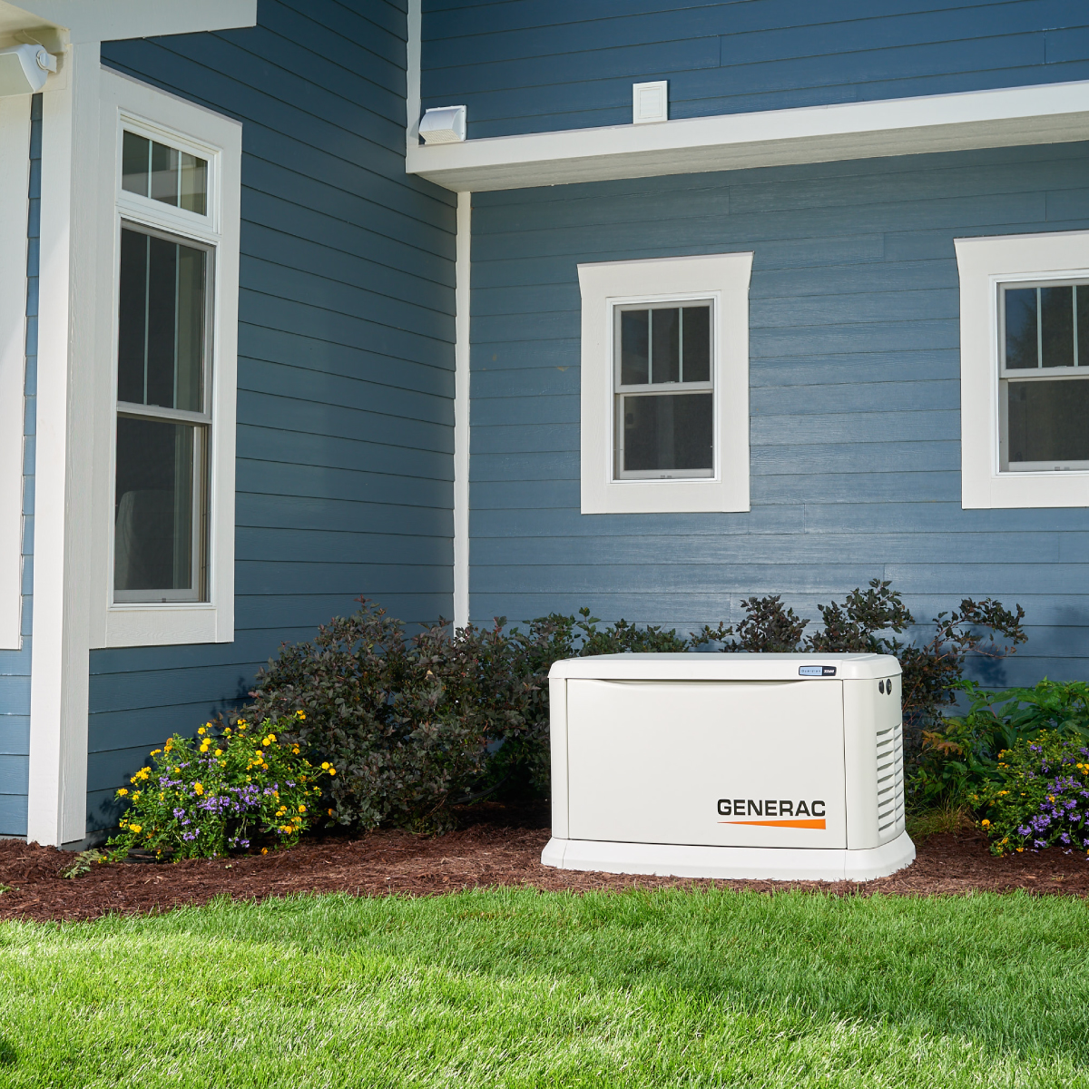 Generac generator in front of house