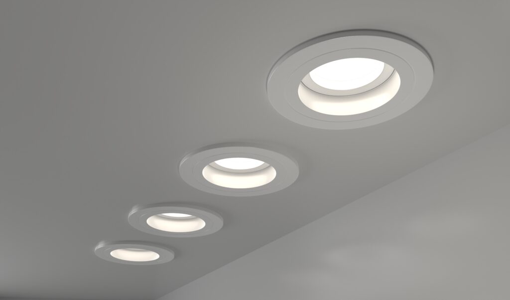 Spotlights recessed ceiling 3D render. Realistic interior room with round glowing downlights at night.