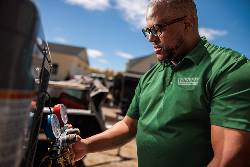universe technician working on a generator