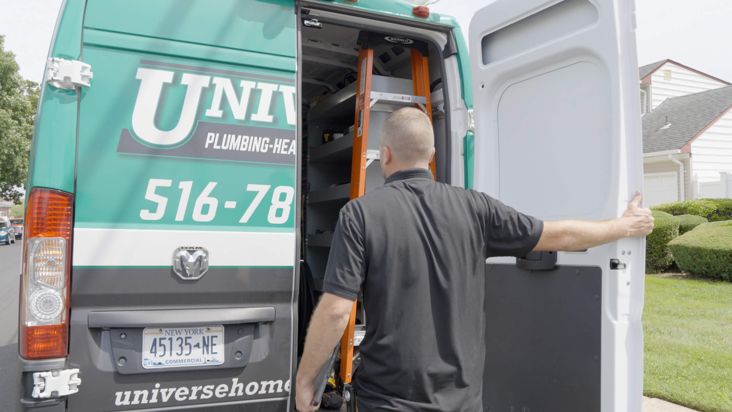 Universe Home Services HVAC Technician near open van doors