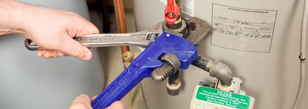 plumber fixing a water heater