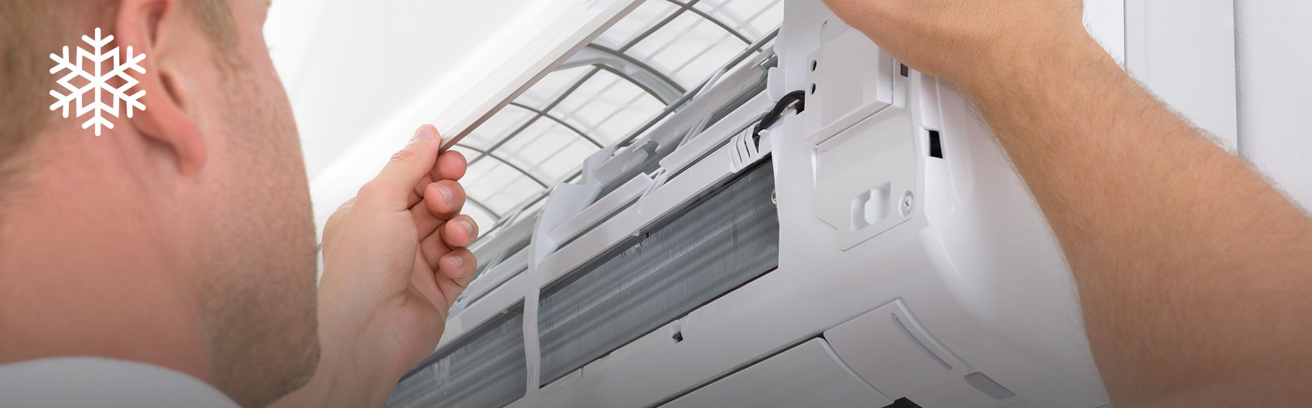 Man fixing air conditioner