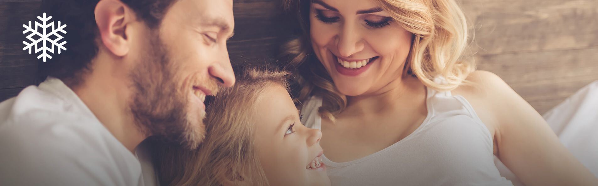 a family relaxing and smiling at each other