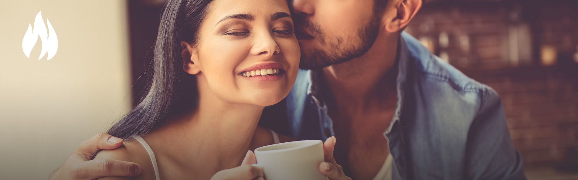 Man kissing woman on cheek