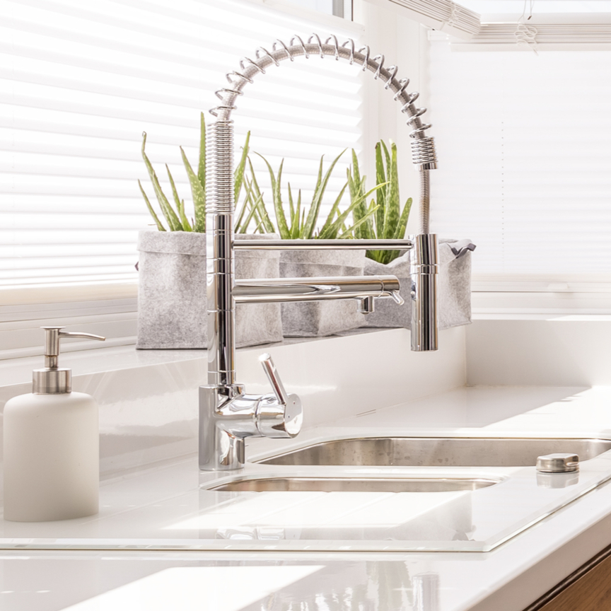 Image of a kitchen sink with faucet upgrade.