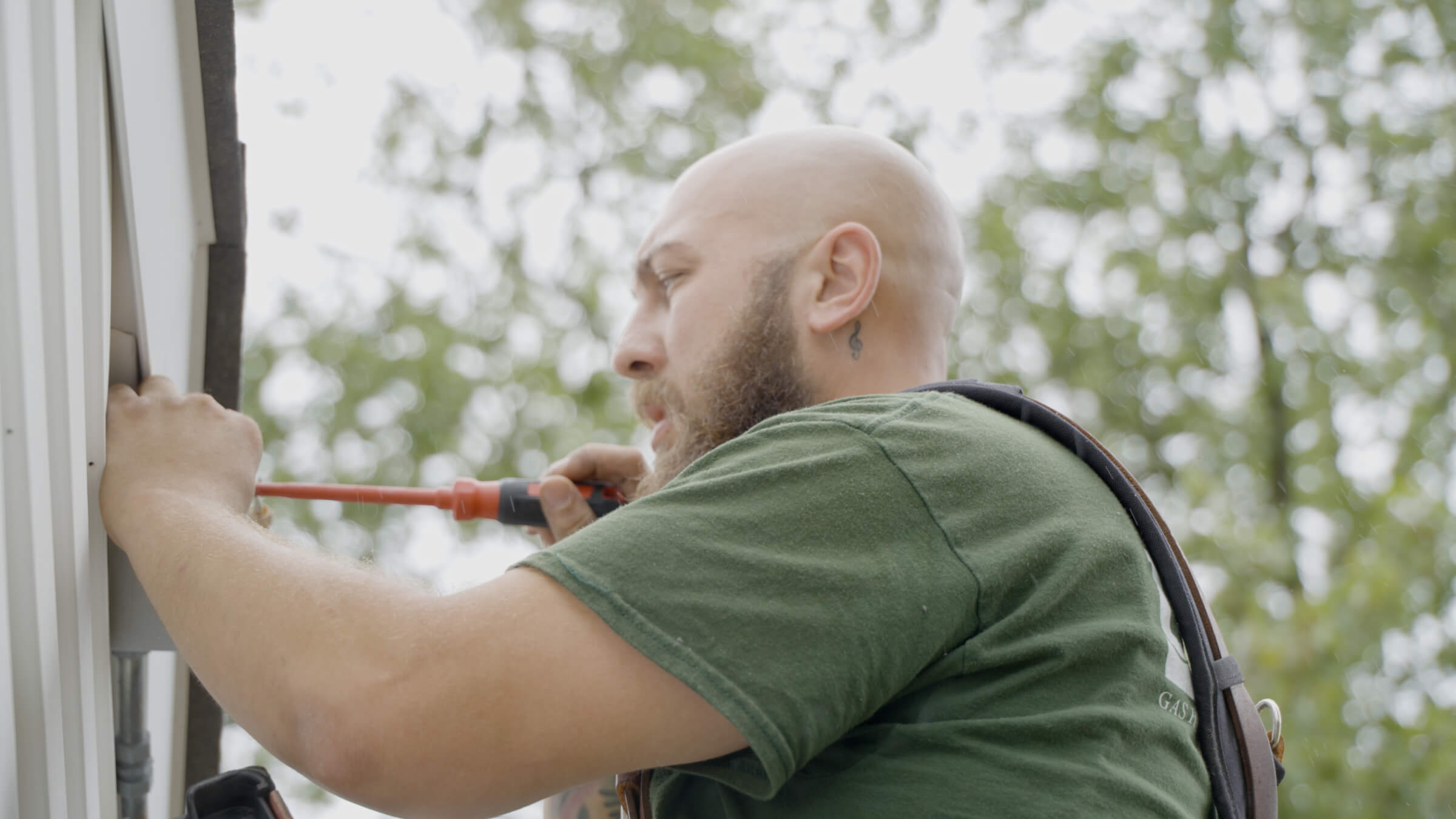 Universe technician installing outdoor lights