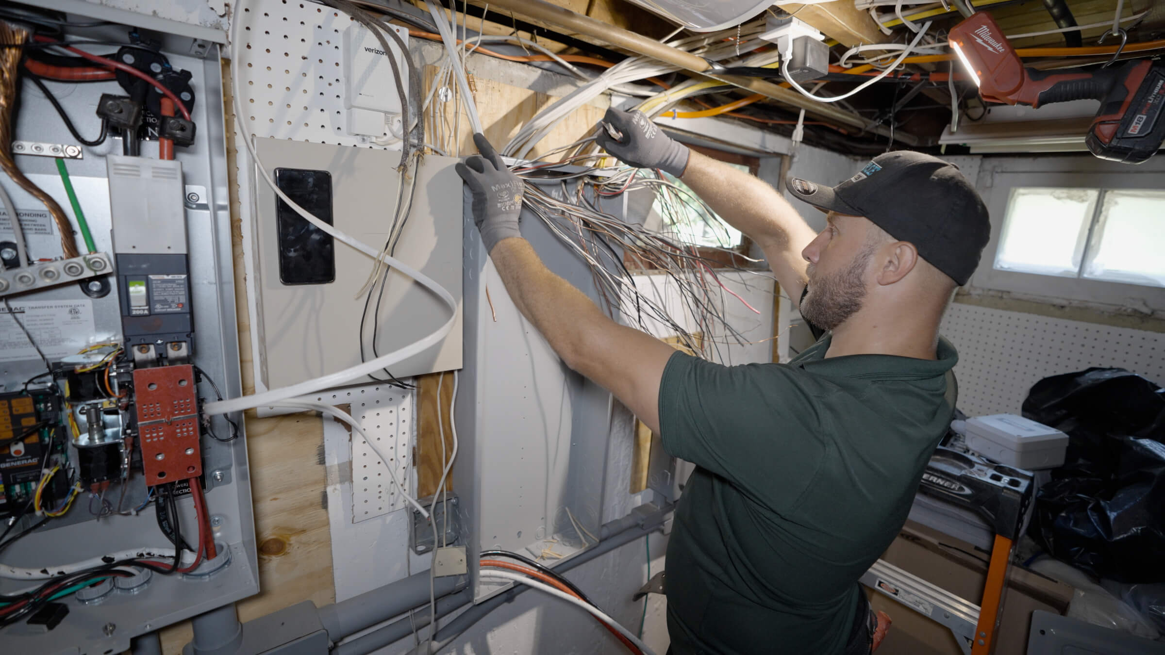 Electrical technician working in basement