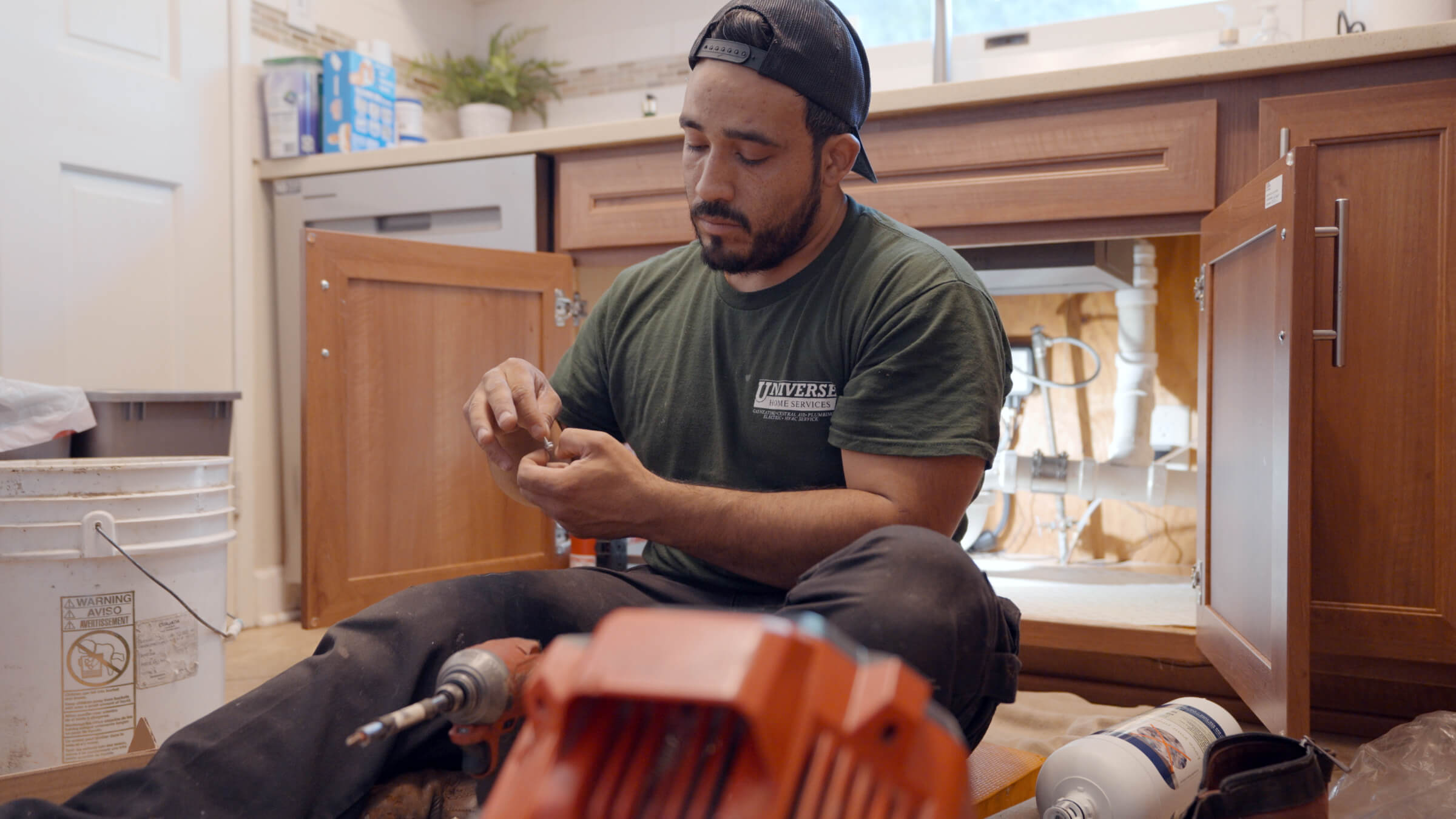 Certified HVAC technician performing spring HVAC maintenance