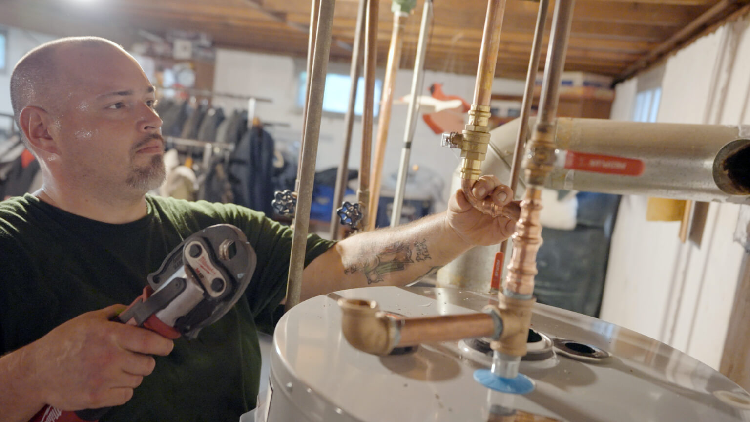 Universe technician working on a water heater